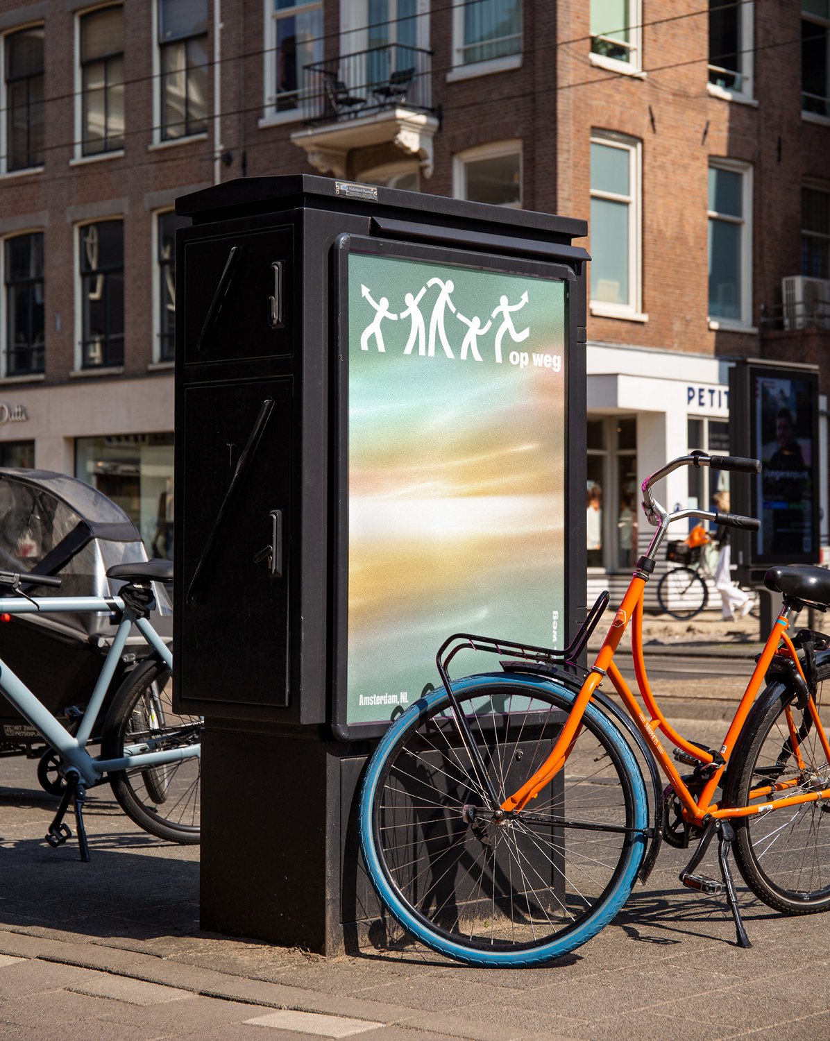Op Weg poster displayed in an Amsterdam street